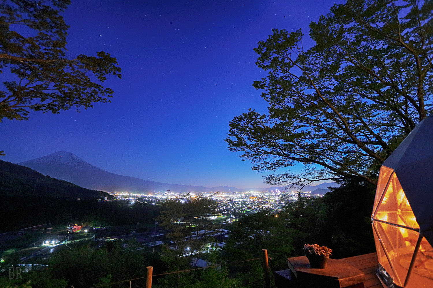 Night view of Mount Fuji and the city lights from Shakushi Gateway Camp