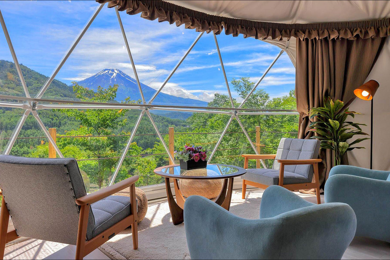 Interior of the Grand Suite Deluxe at Shakushi Gateway Camp with views of Mount Fuji from the window