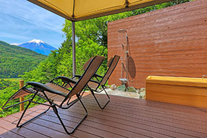 Outdoor terrace for relaxing next to the outdoor sauna at Shakushi Gateway Camp